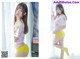 A woman in a pink shirt and yellow panties posing for a picture.
